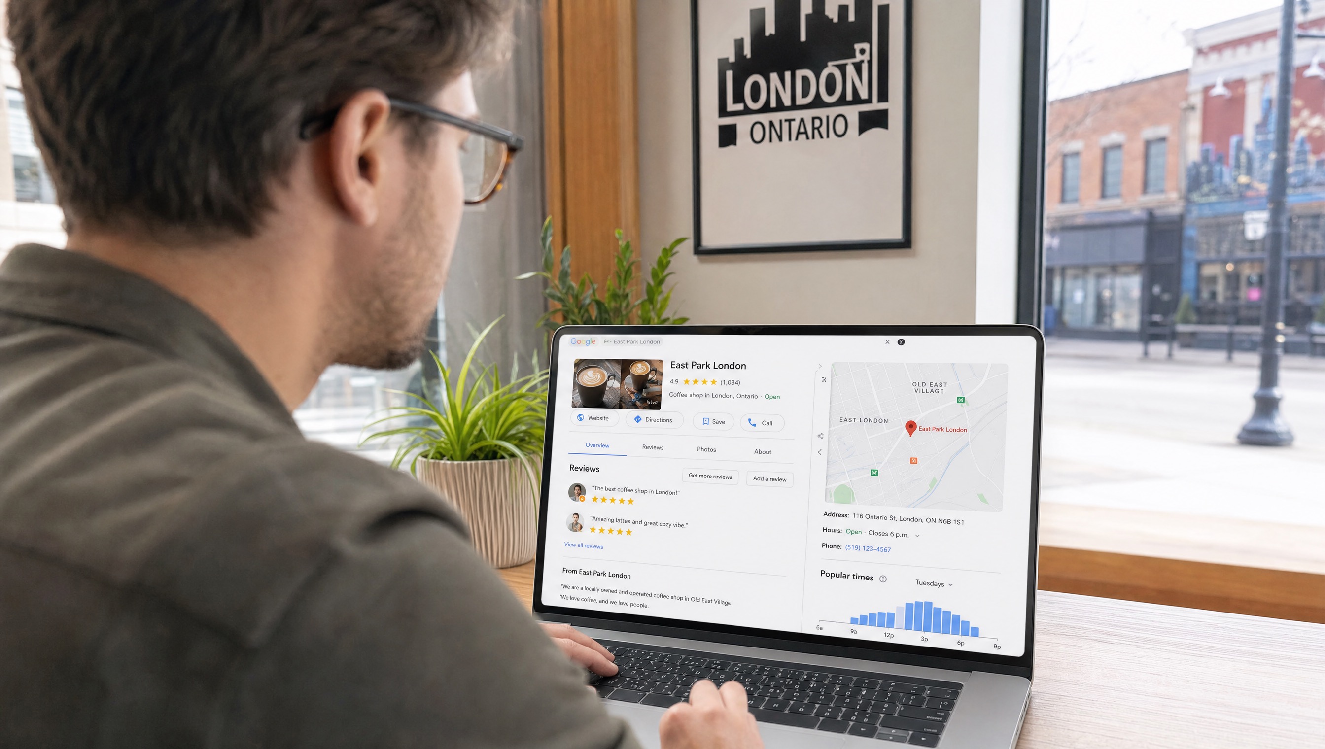 Google Business Profile vs Google My Business - managing local listing in London Ontario Business owner in London Ontario managing Google Business Profile listing on laptop in bright cafe